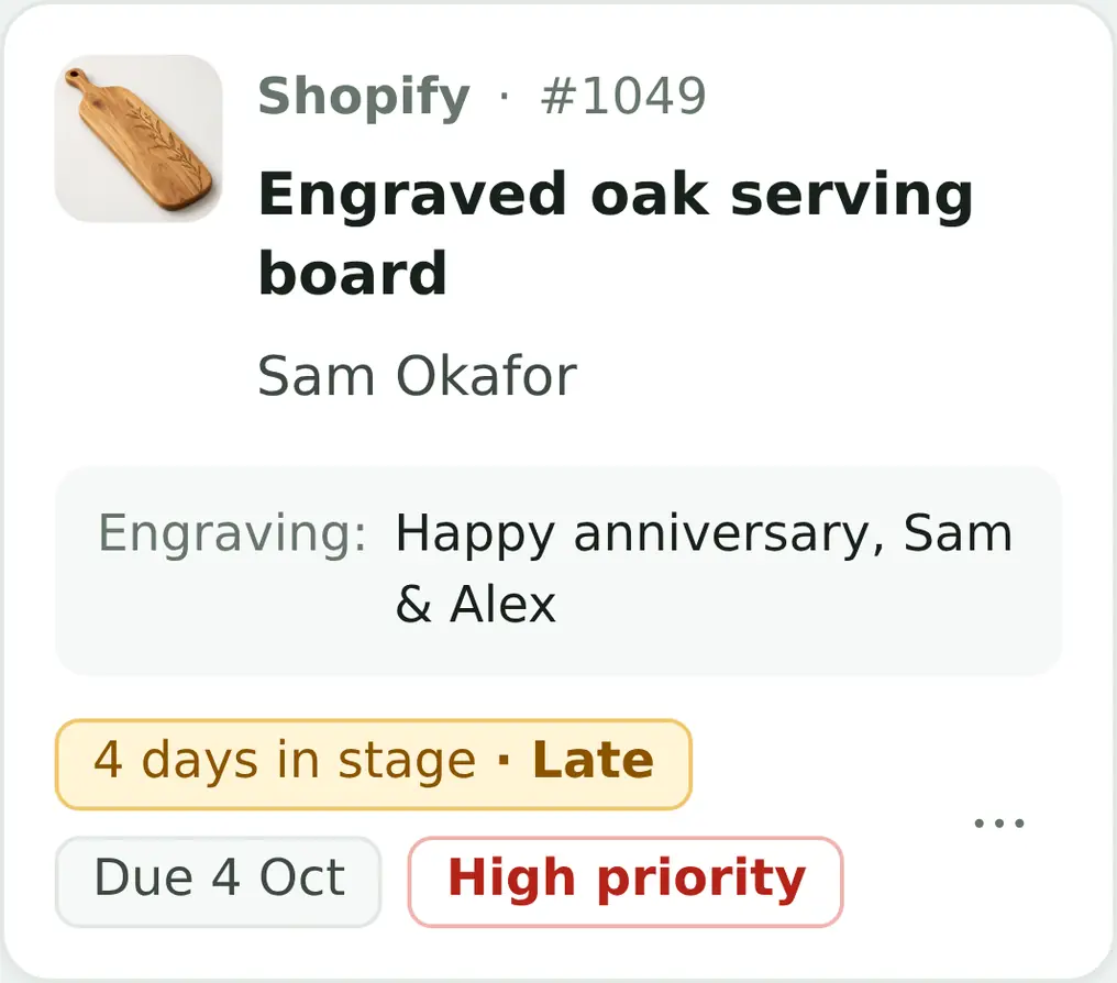 ProdBord job card: Shopify order #1049, engraved oak serving board for Sam Okafor, engraving 'Happy anniversary, Sam & Alex'. Four days in stage, marked late, due 4 October, high priority.